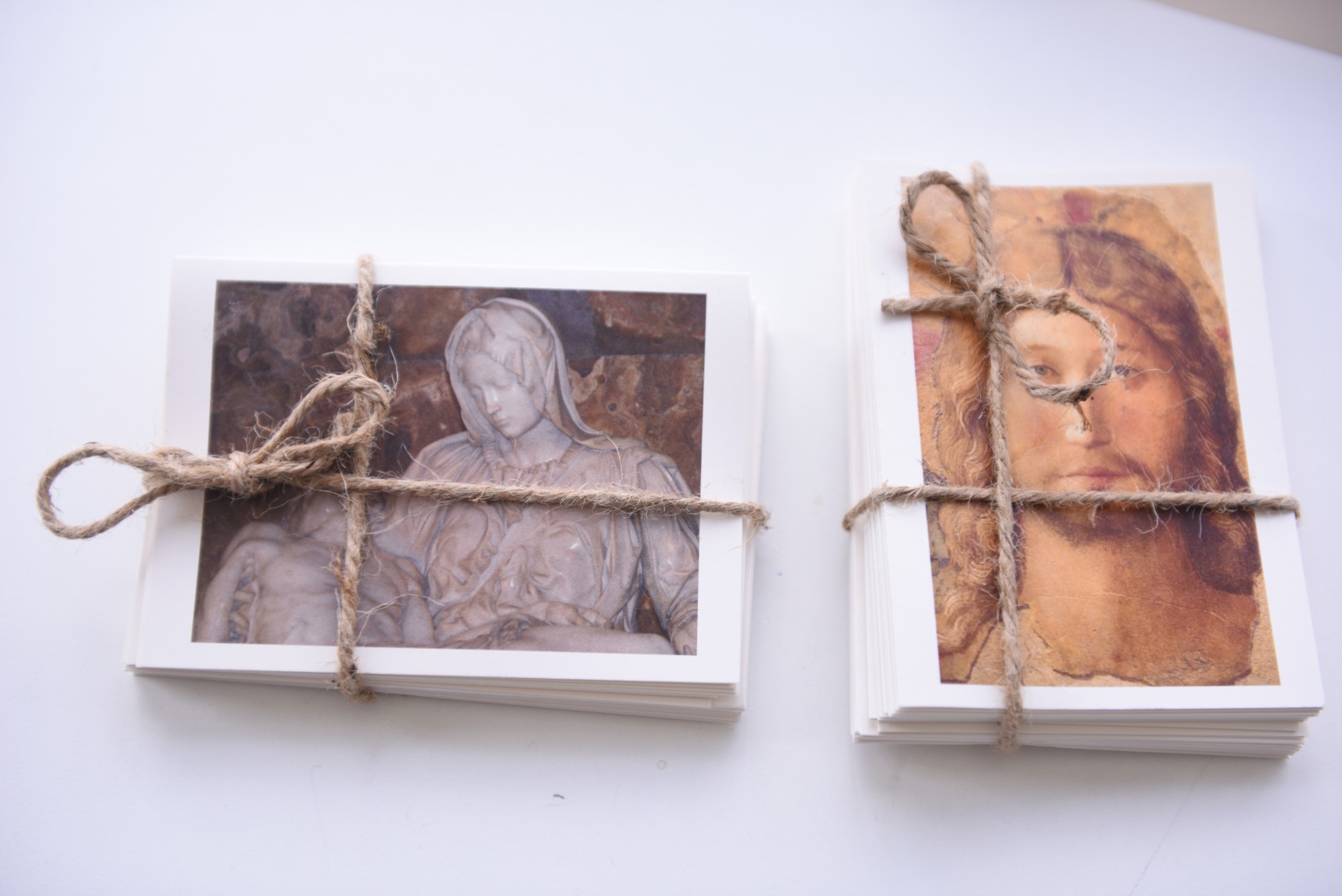 Two stacks of greeting cards tied with twine